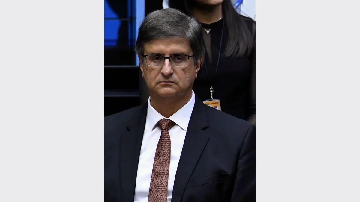 O procurador-geral da República, Paulo Gonet, de terno escuro e óculos